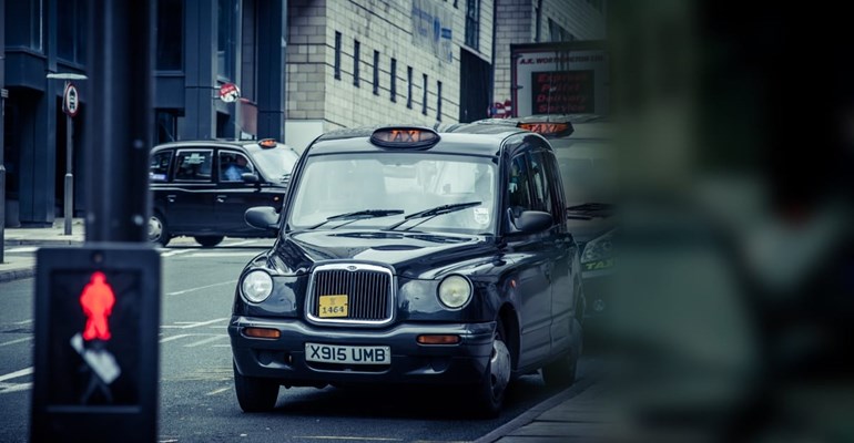 Black cab in city street