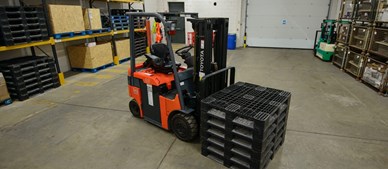Forklift moving pallets