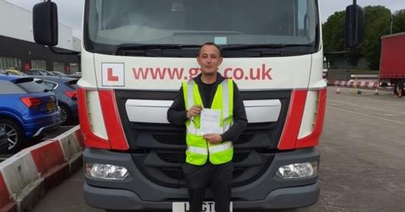 Andrew Allan standing in front of a lorry at GTG Training.